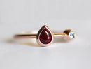 Pear Ruby Engagement Ring with Round Aquamarine Side Gemstone