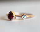 Pear Ruby Engagement Ring with Round Aquamarine Side Gemstone