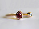 Pear Ruby Engagement Ring with Round Aquamarine Side Gemstone