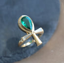 Ankh emerald and diamond ring with baguette diamonds, set in gold.