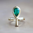 Emerald and baguette diamond ankh ring with natural gemstones and brilliant cut.