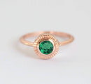 Emerald Ring: Gold ring with round green Emerald stone, 5mm. Solitaire style, 1.6mm band.