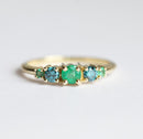 Round Emerald Cluster Ring with 2 Side Blue Diamonds and 2 Side Round Emeralds