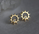 Round white diamond inside sun-shaped gold stud earrings