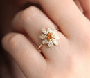 Round white sapphire floral ring with side rubies