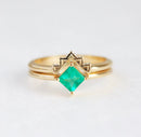 Close-up of aprincess cut emerald ring set showcasing its intricate details.