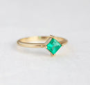 Dainty gold wedding ring with square green emerald stone, part of Livia Princess Cut Emerald Ring Set.