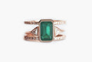 Close-up of Emerald Ring Set with green Emerald center, Diamond pave, and open Diamond band.