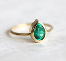Sophisticated Pear Emerald Ring, featuring a green pear-cut Emerald solitaire design.