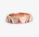 Triangle-shaped purplish red ruby half eternity ring