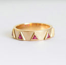 Triangle-shaped purplish red ruby half eternity ring