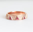 Triangle-shaped purplish red ruby half eternity ring