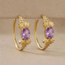 Boucles oreilles dorées violettes
