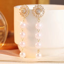 Boucle d'oreille pendante perle