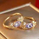 Boucles oreilles dorées violettes