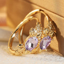 Boucles oreilles dorées violettes