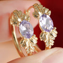 Boucles oreilles dorées violettes