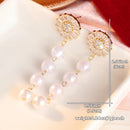 Boucle d'oreille pendante perle