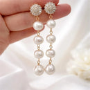Boucle d'oreille pendante perle
