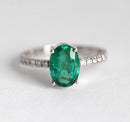 Close-up of an oval emerald ring highlighting its elegant design.