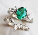 Close-up of Oval Emerald Ring Set with oval-cut Emerald and White Diamonds.