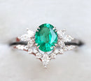 Oval Emerald Ring Set with oval-cut Emerald and White Diamonds.