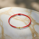 Bracelet cordon rouge