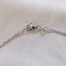 Pendentif or blanc saphir